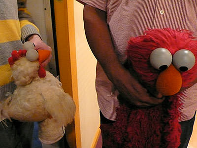 A chicken and elmo